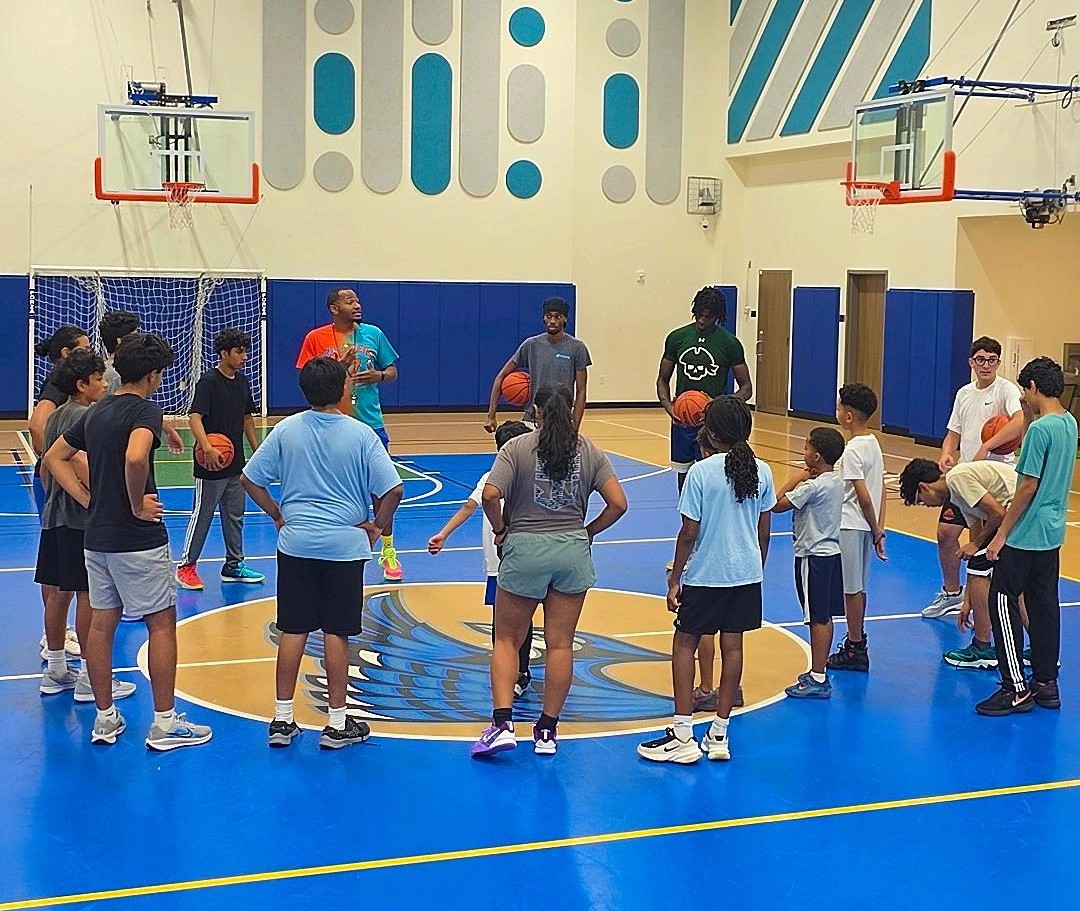 Group of young players running a passing drill